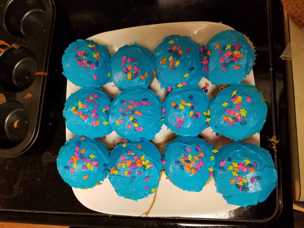 Blue cupcakes with fish sprinkles